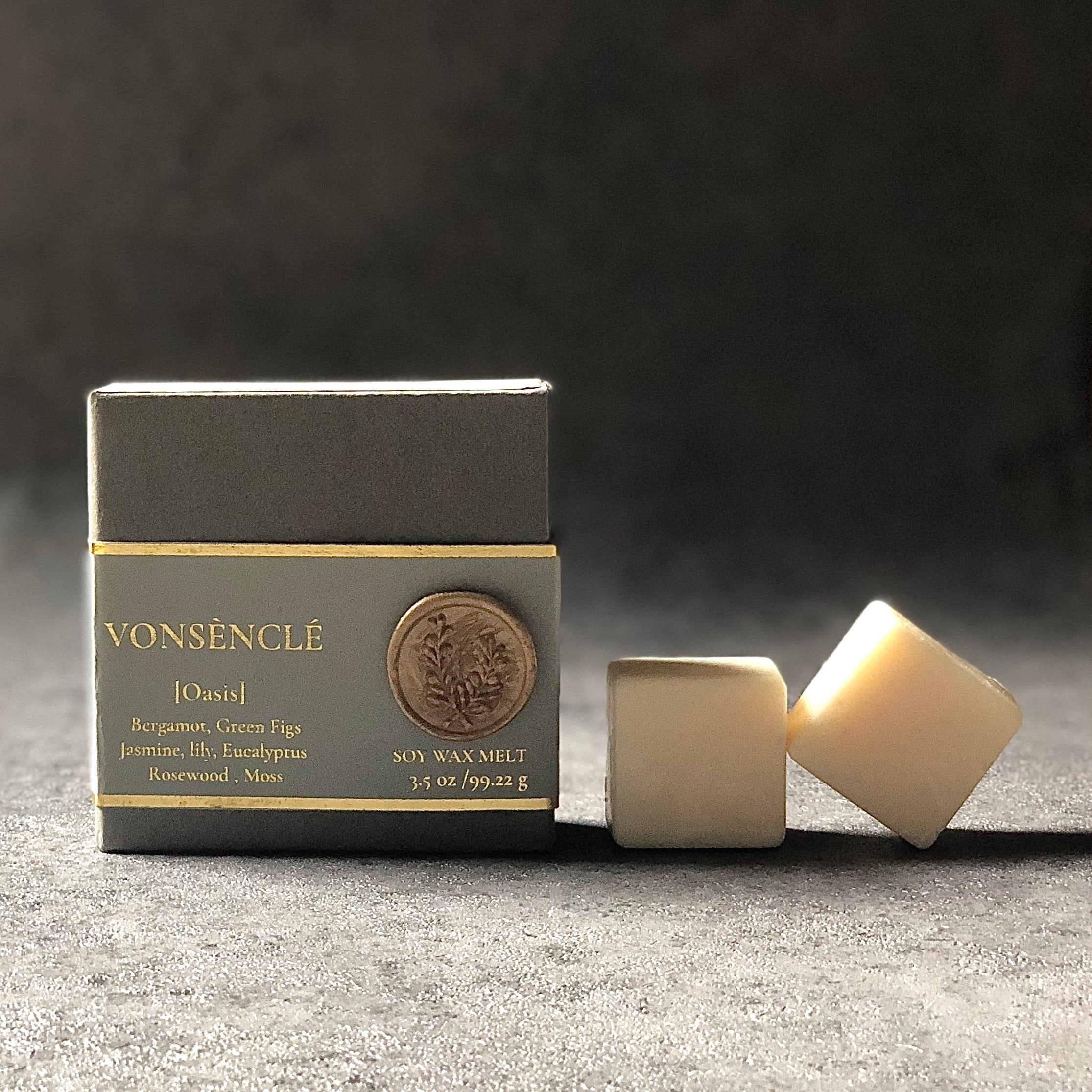 A rigid black box placed next to square-shaped soy wax melts.