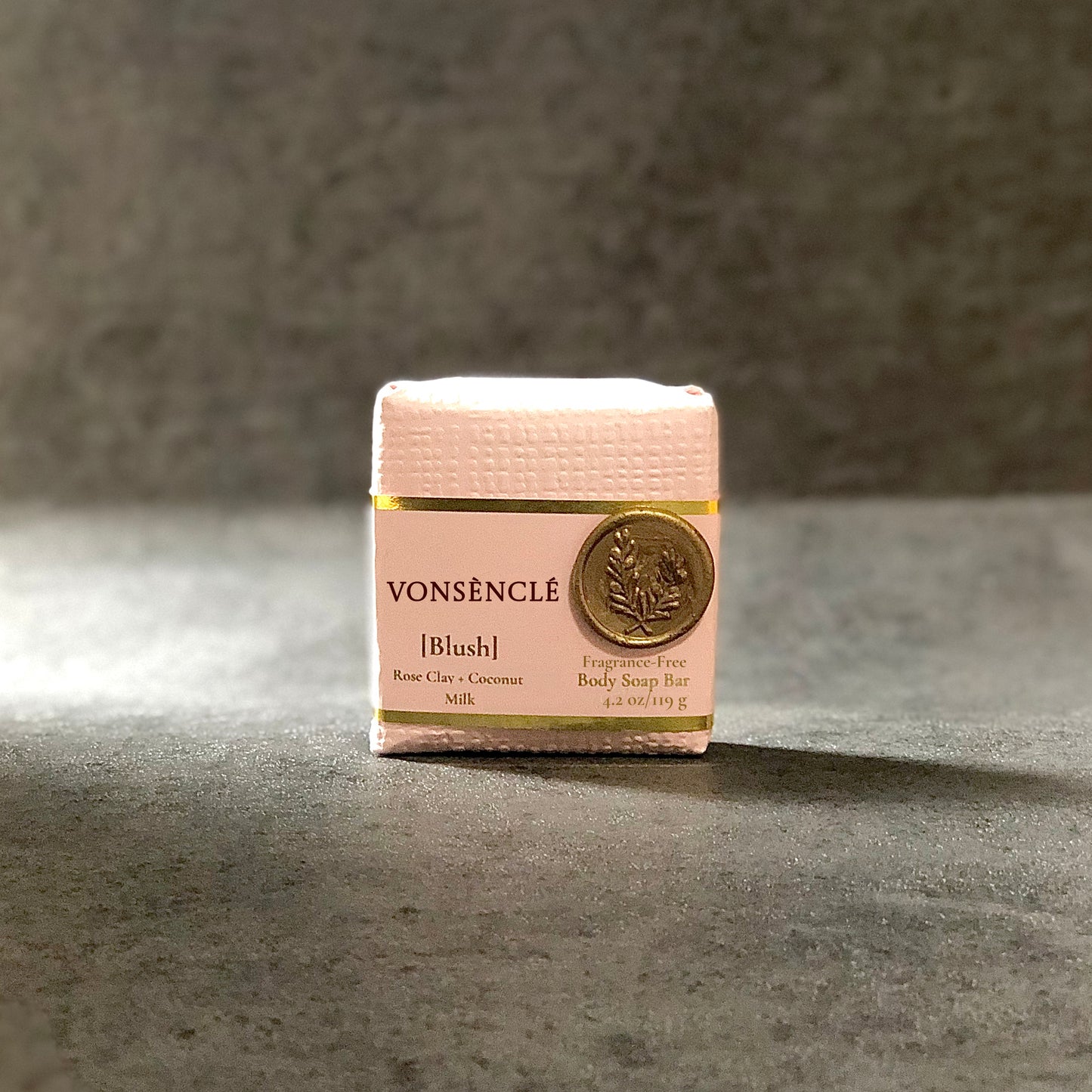 Vonsencle Blush soap bar on a gray surface with a neutral background