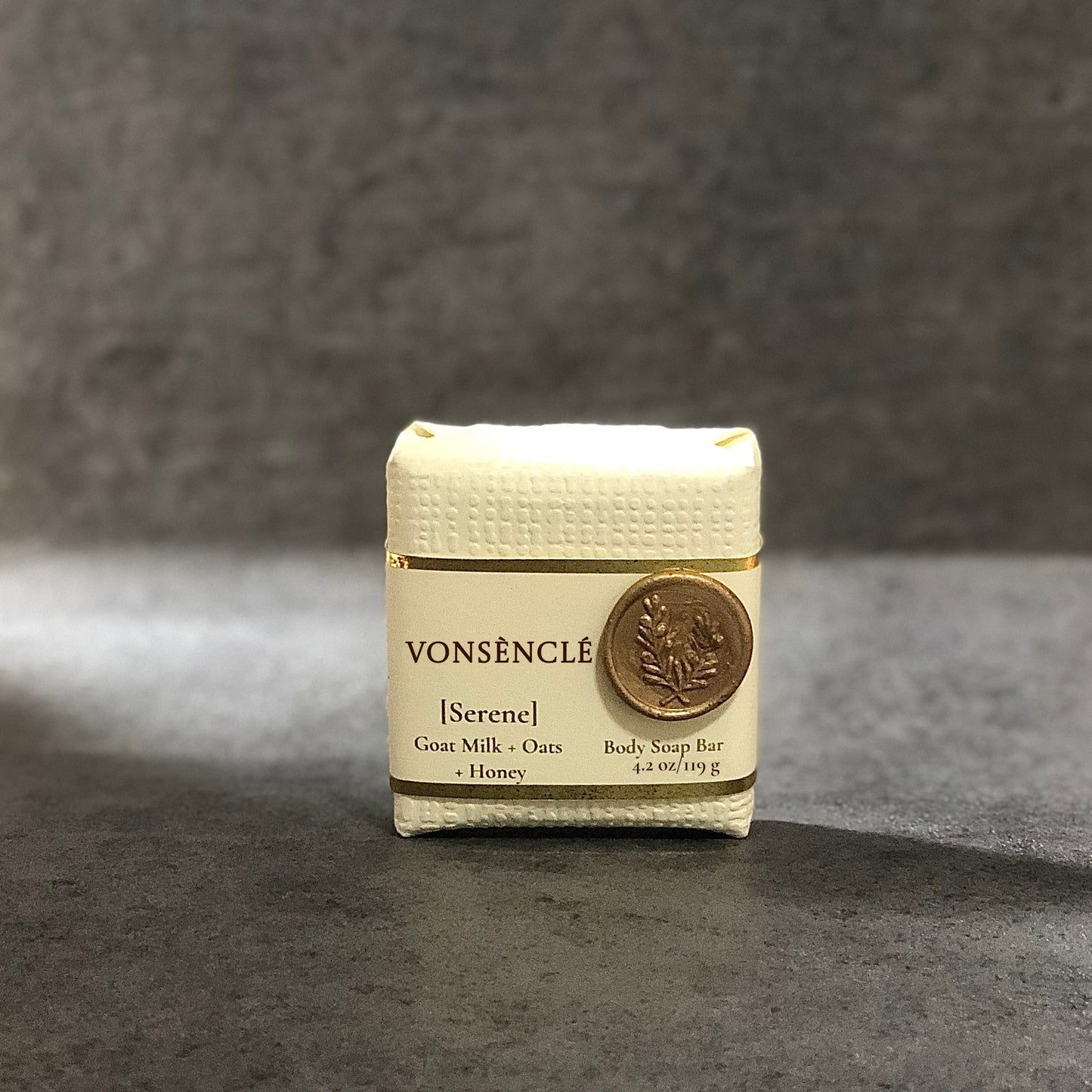 Textured cream colored packaged soap bar  with a wax seal