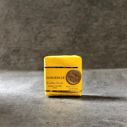A dark-yellow packaged soap bar with 'Vonsènclé' branding on a gray surface.